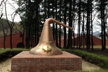 <p>A sculpture of the copper vat is prominently displayed near the visitor&#39;s entrance</p>