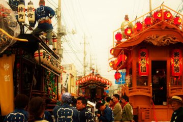 <p>Yatai are prepared along the side streets, as the taiko players get read to do battle.</p>