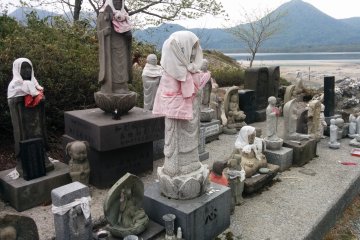 <p>A number of Jizo statues hidden in the back of the grounds</p>