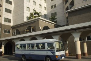 The free shuttle bus that makes stops at Nagasaki Airport 8 minutes away, or Omura Station 5 minutes away.