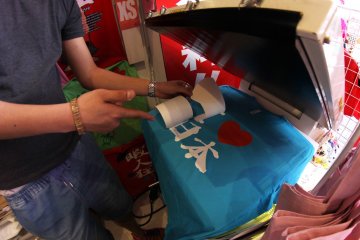 <p>The design is applied on the T-shirt and pressed using a heat press machine.&nbsp;</p>