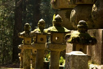 <p>The lanterns play another important role on this graveyard. They come in all sizes and slighty different shapes, often with a soft cover of moss.</p>