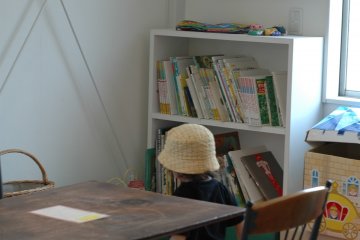 <p>A cozy nook for kids to play, decorated with art by the staff.&nbsp;</p>