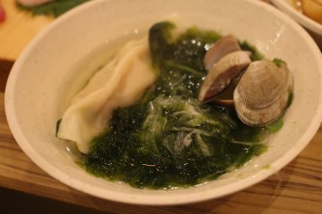 The seafood gyoza is cooked in a similar way, here shown after being placed in a bowl