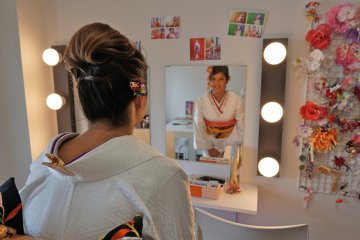 <p>Final look into the mirror before the photo shoot begins!</p>