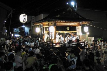 With the musicians performing, the people dance through the night.