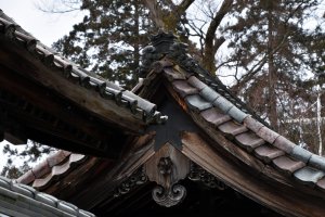 Sad, old roof tiles of the temple building
