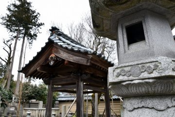 <p>Stone lantern and the water purification font in the back</p>