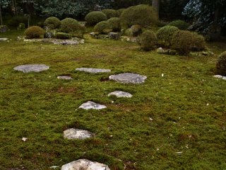 Prayer stones laid out in the moss garden. Lords of Fukui Matsudaira Clan used to step on these stones to reach the main stone which represents the principal image of this temple, and offer prayers in front of it.