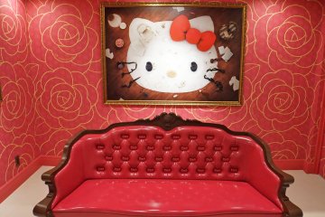 <p>Inside the Lady Kitty House features this painting and fancy love seat.</p>