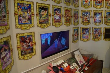<p>The wall of Shin-chan, an ode to the 23 Crayon Shin-chan films with a display case of &quot;props&quot; underneath.&nbsp;</p>