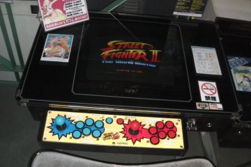 A tabletop version of Street Fighter II in mint condition
