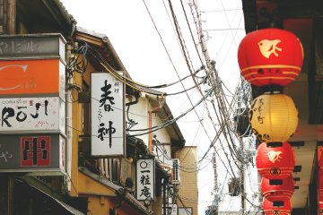 Signs and lanterns fill up every alleyway