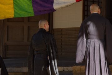 <p>Priests waiting to enter a temple</p>
