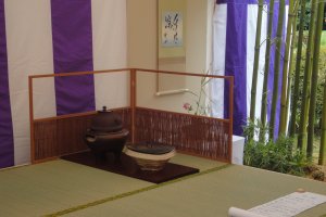 Tea ceremony areas are set under tents in the open-air