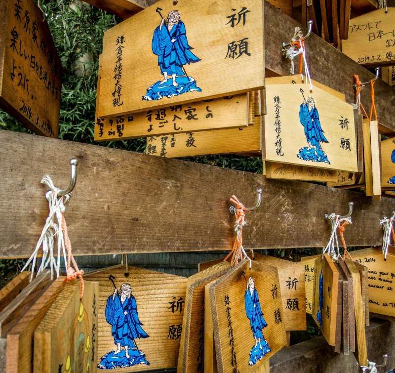 <p>Several wooden prayer tablets, where visitors can write their future wishes</p>