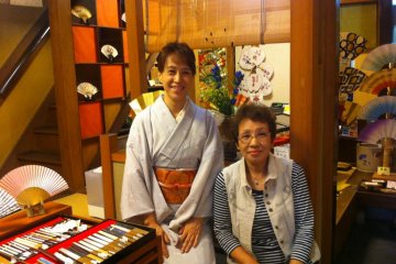 The owner and her daughter Kayako Yoshio welcome you to their home a beautiful merchants house, where you can enjoy Tosenkyo, an Edo Period fan tossing game made alive by Geisha in Hangesho Fan boutique in Kyoto