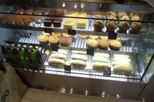 The mouth-watering food case shows a range of sweet and savory treats