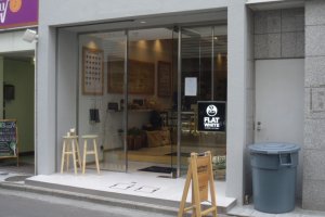 The simple wooden sign is your first glimpse of the Coffee Factory, which is just off the shopping arcade Vlandome