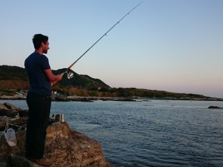 Fishing as the sun sets