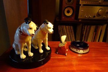 <p>Nipper the dog and some miniature shrine figurines.</p>