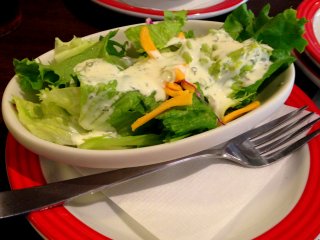 TGI Friday&#39;s salad topped with a refreshing dressing surely is appetizing!
