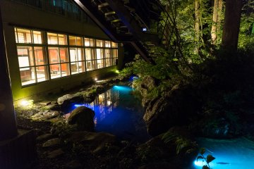 <p>Nighttime view of the carp ponds and dining rooms of the Ryokan
&nbsp;</p>