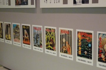 a wall showing the many images from the manga of Mizuki Shigeru