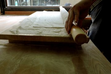 <p>Rolling out the dough</p>