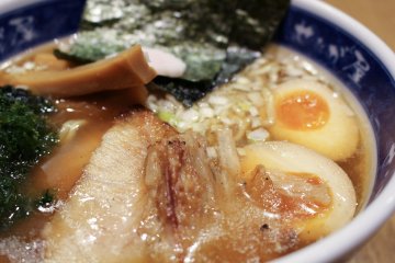 <p>Sliced pork, soft-boiled egg and bamboo shoots all competing for your attention.</p>