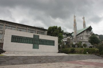 <p>Left: The granite-and-bronze monument of the twenty-six saints of Japan, all martyred at Nishizaka Hill in Nagasaki on February 5, 1597. This monument was designed by Prof. Yasutake Funakoshi. Behind it is a museum dedicated to the 26 martyrs and to the history of Christianity in Japan. Right: St. Philip Church. Dedicated to St. Philip of Jesus, the 24-year-old Mexican who was the first among the 26 to pass away.</p>