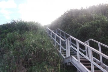 Secluded staircase on the back end of the island