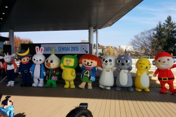 <p>Characters line-up for photos</p>
