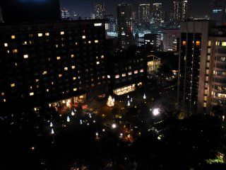 Christmas illumination in the hotel garden viewed from a guest room balcony
