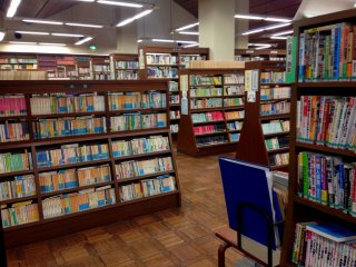 Japanese books arranged in several categories and sections

