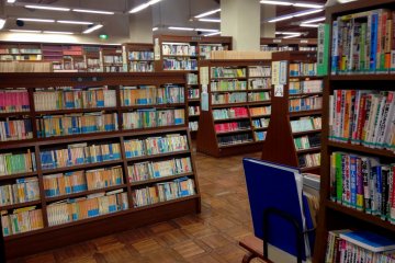 Japanese books arranged in several categories and sections
