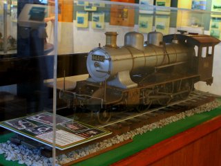 Old train models in a huge glass display case