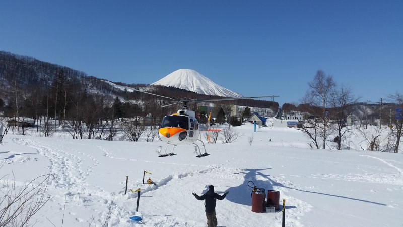 The helicopter landing with Mt Yotei in the background