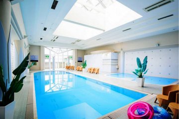 The indoor pool is spacious and light filled and is open all year