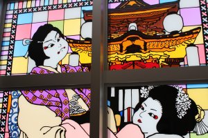 A stained glass window depicting a scene from kabuki