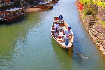 Visitors can take a leisure boat tour down the Hozu River. 