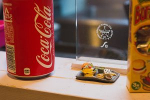 Miniature burger set next to my Coke