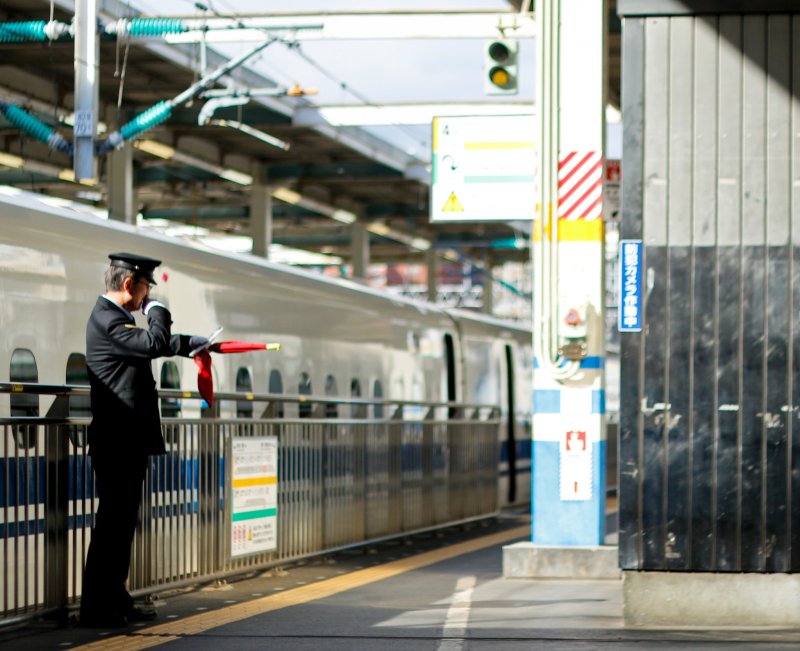 Officer giving signals for the train