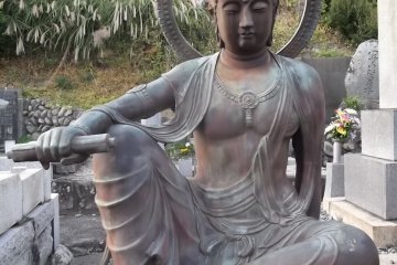 Another relaxed Buddhist deity