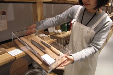 A NakagawaMasashithi employee shows off the quality knives from Tadafusa