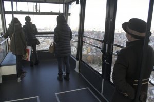 On the way down, passengers move toward the front window for the best view.