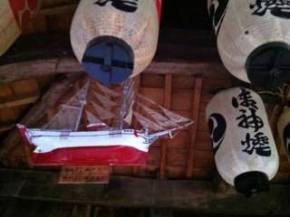 Inside, model ships hang from the rafters indicating the main interests of the shrine's patrons