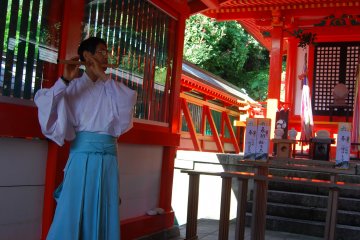Asuka Shrine's priest plays the flute