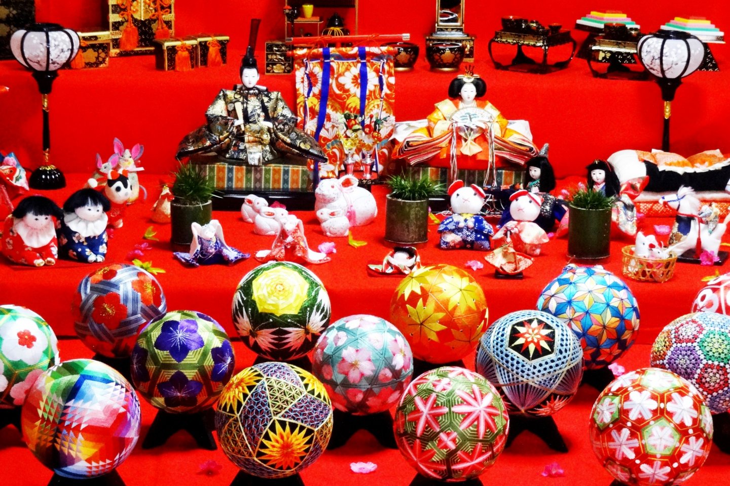 A display of Hina dolls and woven temari