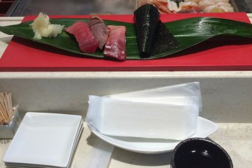 Try the stand-up sushi bar in Haneda Airport.